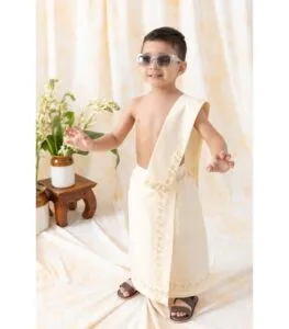 Kid wearing traditional Kutty Mund white dhoti Kerala style