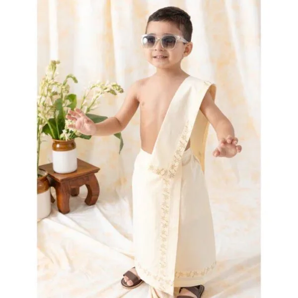 Kid wearing traditional Kutty Mund white dhoti Kerala style