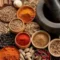 Masala and spices assortment in bowls with herbs and seeds