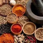 Masala and spices assortment in bowls with herbs and seeds